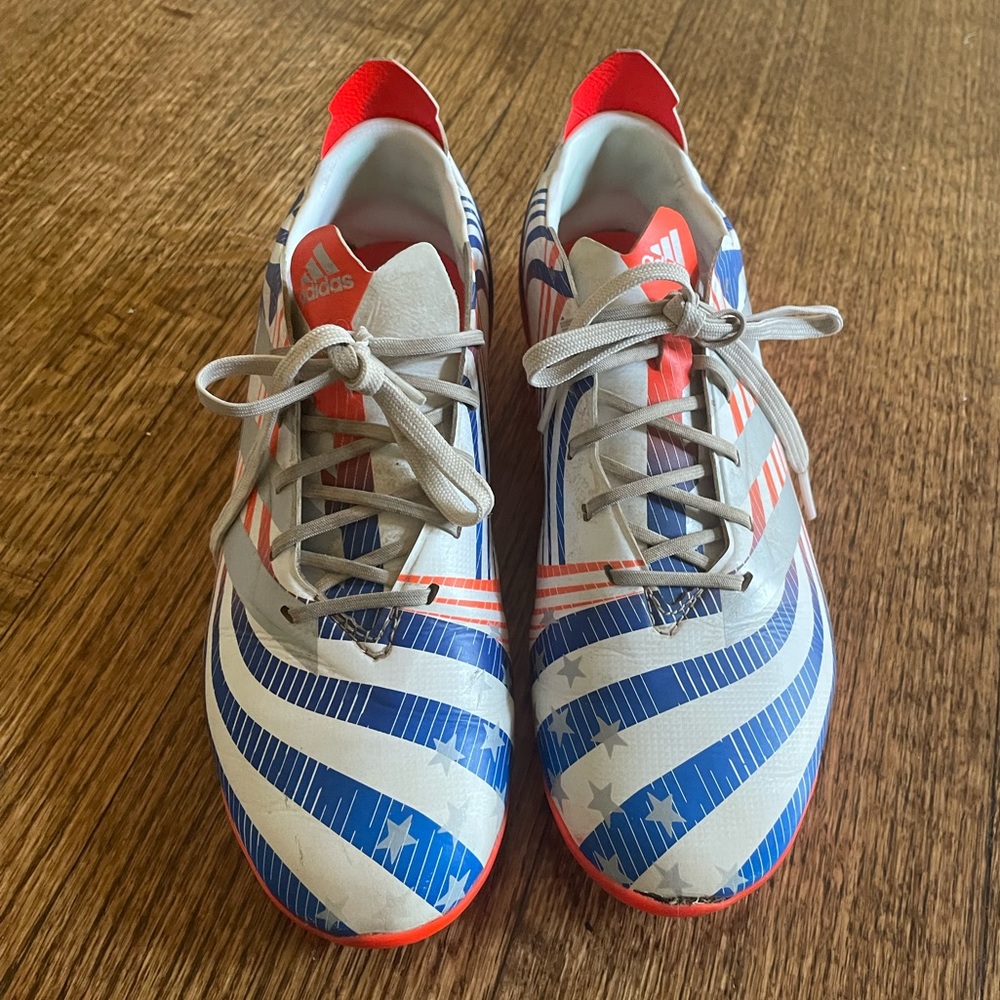Adidas boys soccer/ football cleats. Size 4.5. Stylish with flair. Easy to spot